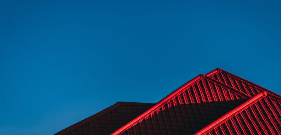 Metal Red Roof and Blue Sky | RME Roofing