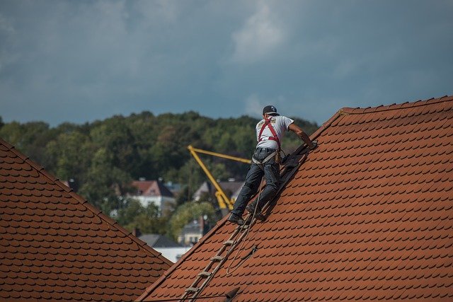 Roofer Repairing Ceramic Roof Tiles | RME Roofing